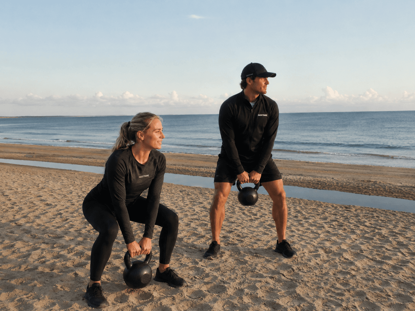Passtrike coaches with kettlebells outdoors